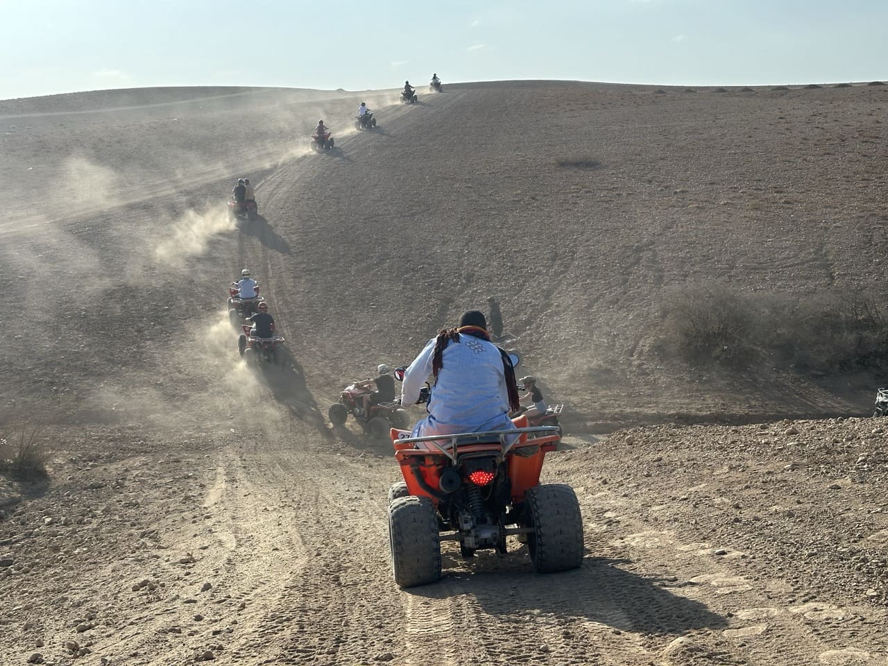 Embark on an unforgettable adventure in the Agafay Desert with this exclusive package: Quad and Camel ride, including round-trip transport from Marrakech